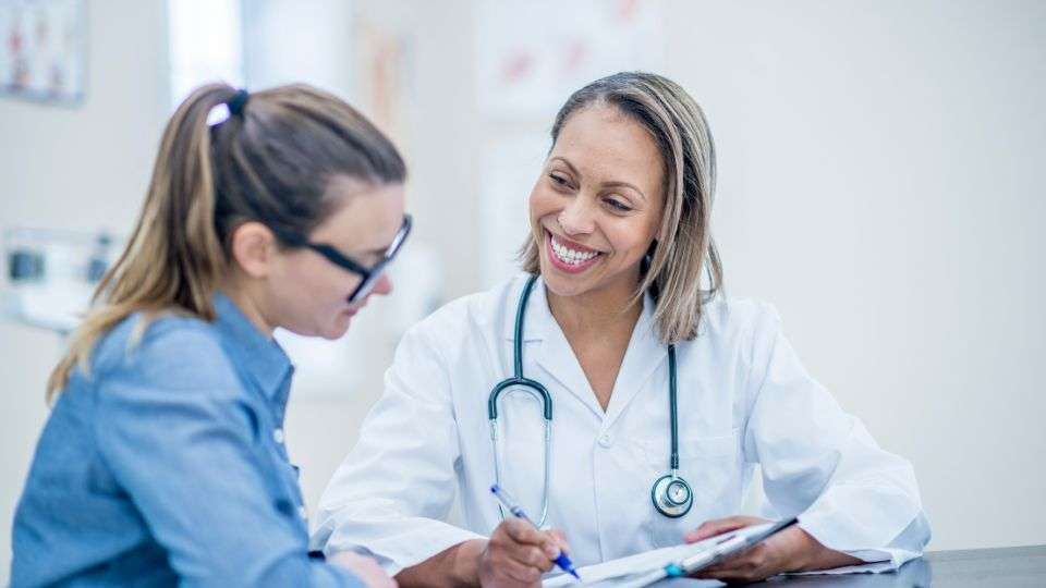 Pharmacist providing personalised healthcare advice to a patient in a local pharmacy