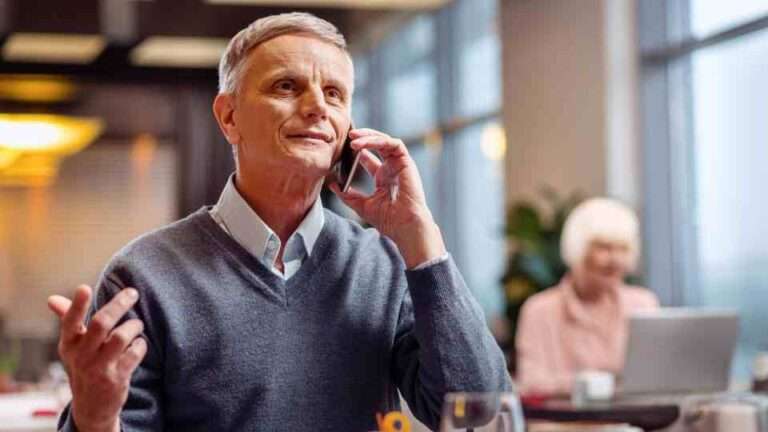 Man discussing ear health concerns with a pharmacy professional