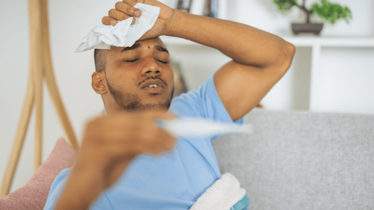 Patient struggling with flu symptoms while resting at home